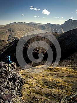 Anonymous hiker admiring view of mountains