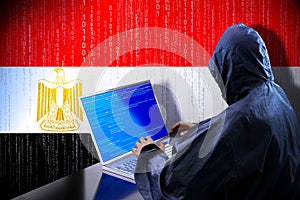 Anonymous hooded hacker, flag of Egypt, binary code - cyber attack concept