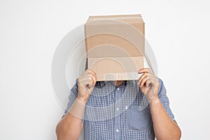 An anonymous man with a box on his head concealing his identity I