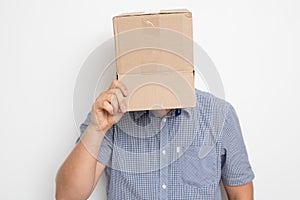 An anonymous man with a box on his head concealing his identity I