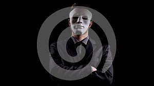 Anonymous man in business suit folding hands, masking personality, hiding income