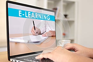 Anonymous person typing on laptop with e learning digital web program displayed on screen. Online education, e-learning