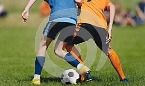 Anonymous Soccer Players Compete in a Duel on Sunny Day. Football Game For Children. Soccer Background of Young Players