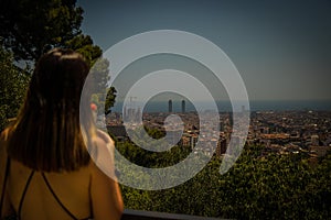 Anonymous woman looking at beautiful city