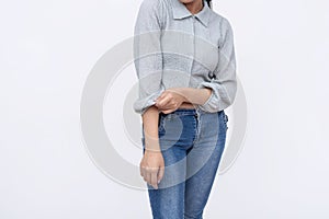 An anonymous woman rolls up her cuffs getting into business. Isolated on a white background
