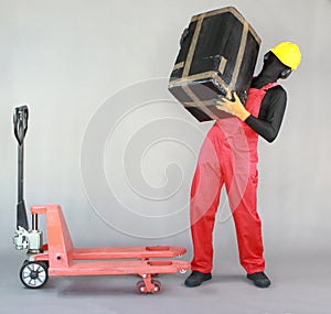 Anonymous worker lifting  heavy package. Front view.