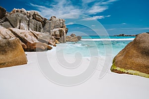 Anse Cocos, La Digue island, Seychelles. Tropical lagoon with granite boulders in the turquoise water and a pristine