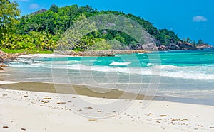 Anse Kerlan beach under a blue sky