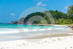 Anse Kerlan beach under a blue sky