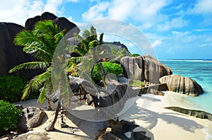 Anse Source d`Argent beach with big granite rocks in sunny day. La Digue Island, Indian Ocean, Seychelles.