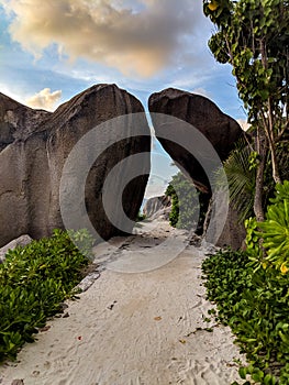 Anse Source d`Argent beach with granite boulders at sunset, La Digue Island, Seychelles