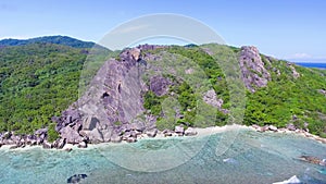 Anse Source D'Argent Beach in La Digue, Seychelles. Aerial view of tropical coastline on a sunny day