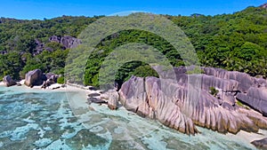 Anse Source D\'Argent Beach in La Digue, Seychelles. Aerial view of tropical coastline on a sunny day