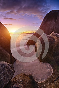 Anse Source d`Argent beach in the Seychelles at sunset