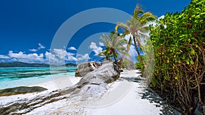 Anse Source d`Argent. Exotic tropical paradise beach on island La Digue in Seychelles. Blue ocean and sky, palm trees