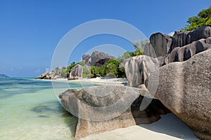 Anse Source d`Argent - granite rocks at beautiful beach on tropical island La Digue in Seychelles