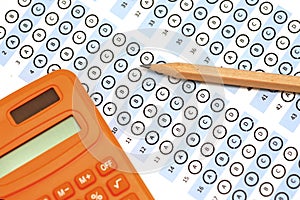 Answer sheet test score with pencil calculator