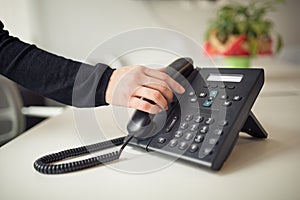 Answering phone call.Phone ringing.Good or bad news.Business failure.Customer service help center.Secretary answering phone photo