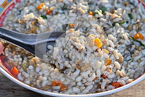 Ant egg fried in plate on wood