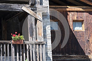 Balcony with flowers of a typical house in Antagnod, Aosta Valley, Italy photo