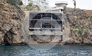 Antaliya, Turkey - October 30 2021: Abandoned building in the rock photo