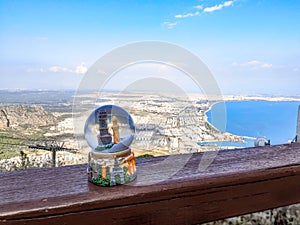 Antalya snow globe on a background of mountain, city and the Mediterranean Sea - top view. Tourist concept of New Year and