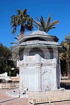 Antalya - Turkey - February 11, 2022: Old Ottoman fountain in Dokuma Park, a popular park with play areas, and open-air museum in