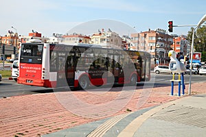 ANTALYA, TURKEY - JUNE 7, 2015: City bus standing in front of a traffic light at the crossroads in Antalya, Turkey