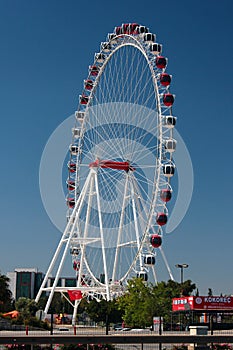 Antalya, Turkey - May 13, 2022: Ferris wheel in Heart of Antalya amusement park near Migros 5M shopping mall, a popular meeting