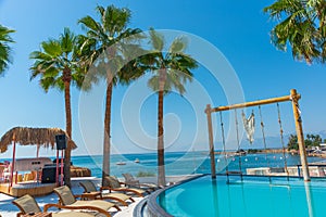 ANTALYA, TURKEY: Swimming pool and swing on the territory of Fosforlu beach on a sunny day.