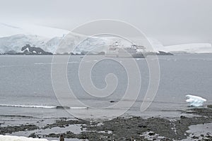Antarctic explorer shelter shot from the shore on a cloudy day