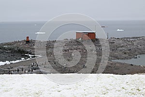 Antarctic explorer shelter shot from the shore on a cloudy day