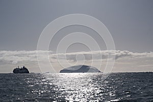 Antarctic icebergs pn a clear day with an amazing sky as background