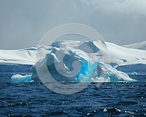 Antarctic nature landscape with icebergs in Greenland icefjord during midnight sun. Antarctica, Ilulissat, West