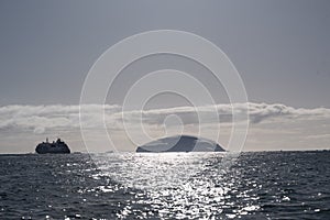 Antarctic ocean with Iceberg at sunset