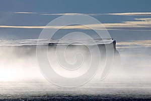 Antarctic table iceberg in morning mists