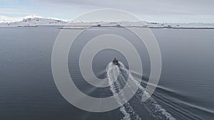 Antarctica aerial flight over fast moving boat.