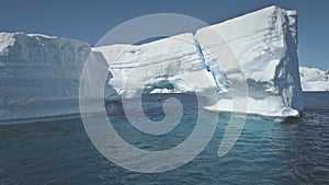 Antarctica aerial flight over the ocean to iceberg