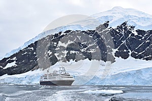 Antarctica an amazing landscape with an expedition cruise ship