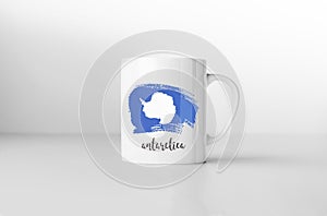 Antarctica flag on white coffee mug.