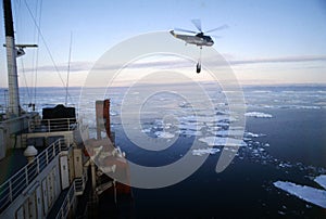 antarctica helicopter of the argentine navy landing the icebreaker irizar photo