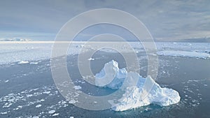 Antarctica iceberg in brash ice aerial view photo