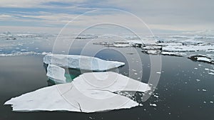 Antarctica iecberg float ocean open water aerial
