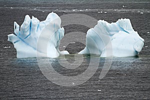 Antarctica - Non-Tabular Iceberg Floating In The Southern Ocean