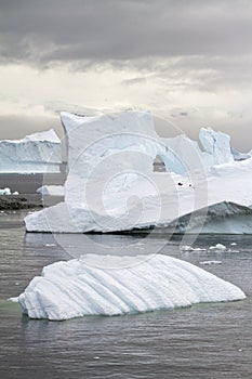 Antarctica - Non-Tabular Iceberg Floating In The Southern Ocean