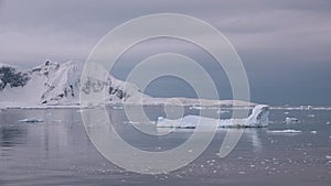 Antarctica. Snowy mountains and icebergs. Cruise Travel to the Edge of the Earth. Amazing beautiful views of Nature and