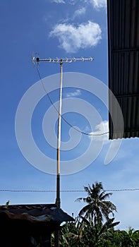 An antena of television with perfect blue sky