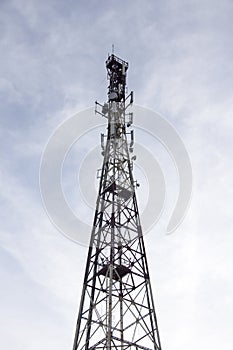 Antenna and cell phone cellular towers on a mountaintop on a clear dayin autumn.