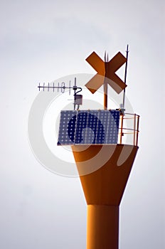 Antenna, lightning rod, solar panel and other measuring utensils on top of a pole