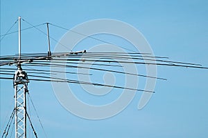 Antenna mast against blue sky background